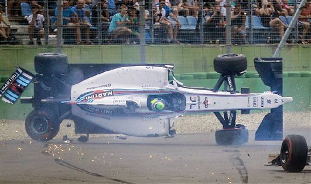 Il Gran Premio di Germania del 20 luglio vede l’incidente, per fortuna senza conseguenze, di Felipe Massa. Rosberg taglia per primo il traguardo, seguito da Bottas e Hamilton (Ap)